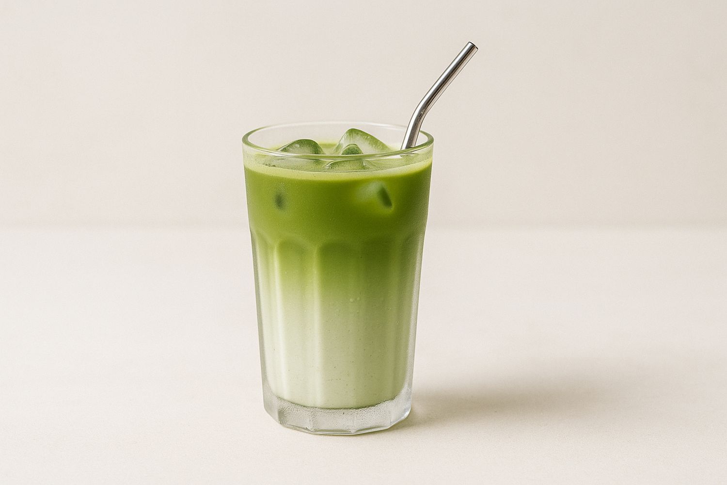 Refreshing iced matcha latte with layered milk and matcha at Tangscape, a Cafe in Forest Hills