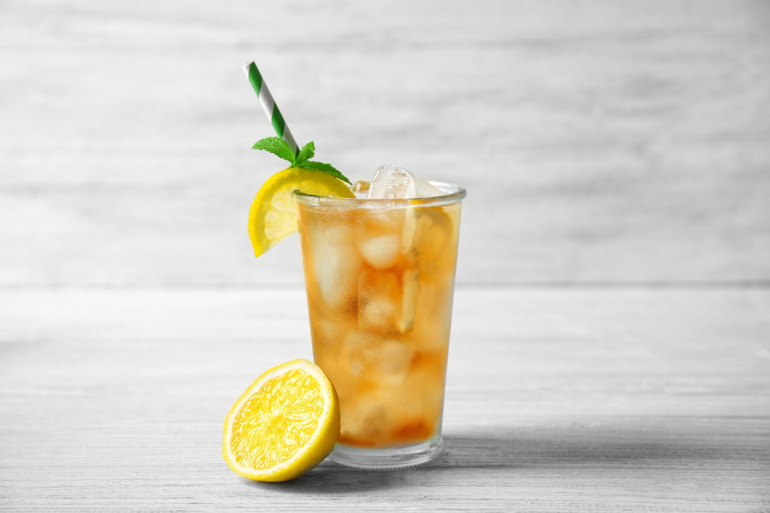 Refreshing lemon iced tea garnished with mint and lemon at Tangscape, a Cafe in Forest Hills