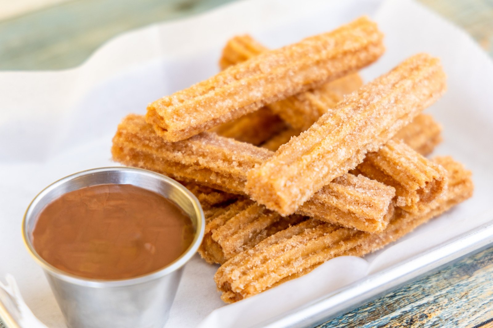 Churros coated with cinnamon sugar served with chocolate dipping sauce