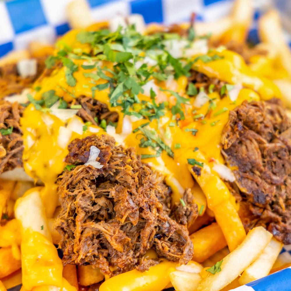 Loaded fries topped with shredded birria beef, melted cheese, onions and fresh cilantro Loaded fries topped with shredded birria beef, melted cheese, onions and fresh cilantro