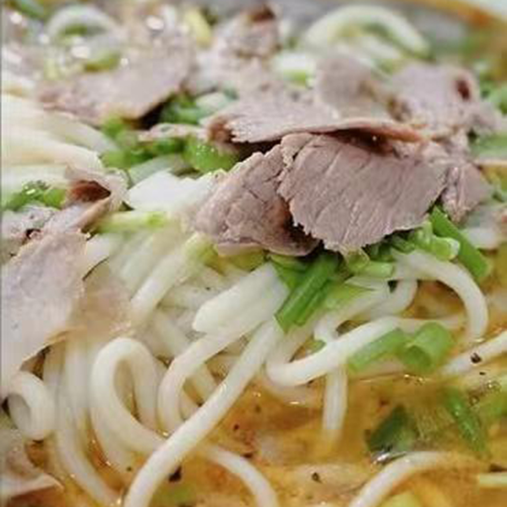 Savory beef noodle soup with fresh herbs at Taste of Xi'an, a Chinese Restaurant in Cromwell