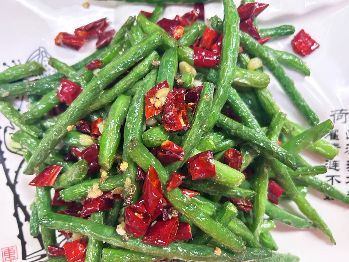 Plate of stir - fried green beans with red chilies at Tasty Chinese Cuisine, a Chinese restaurant in Des Plaines