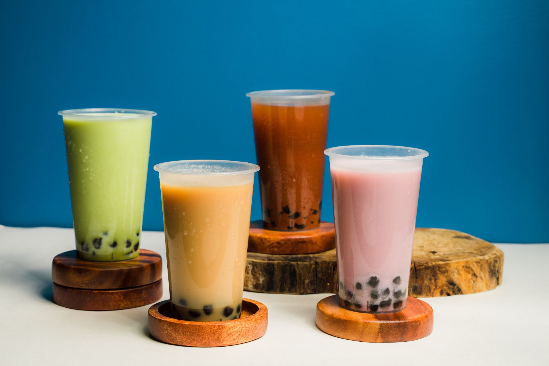 Assorted bubble teas in green, beige, brown, and pink flavors at Tea & Brown - Yellowstone, a Bubble Tea Store in West Yellowstone