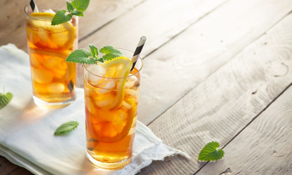 Refreshing lemon iced tea with mint leaves and lemon slices at Tea & Brown - Yellowstone, a Bubble Tea Store in West Yellowstone