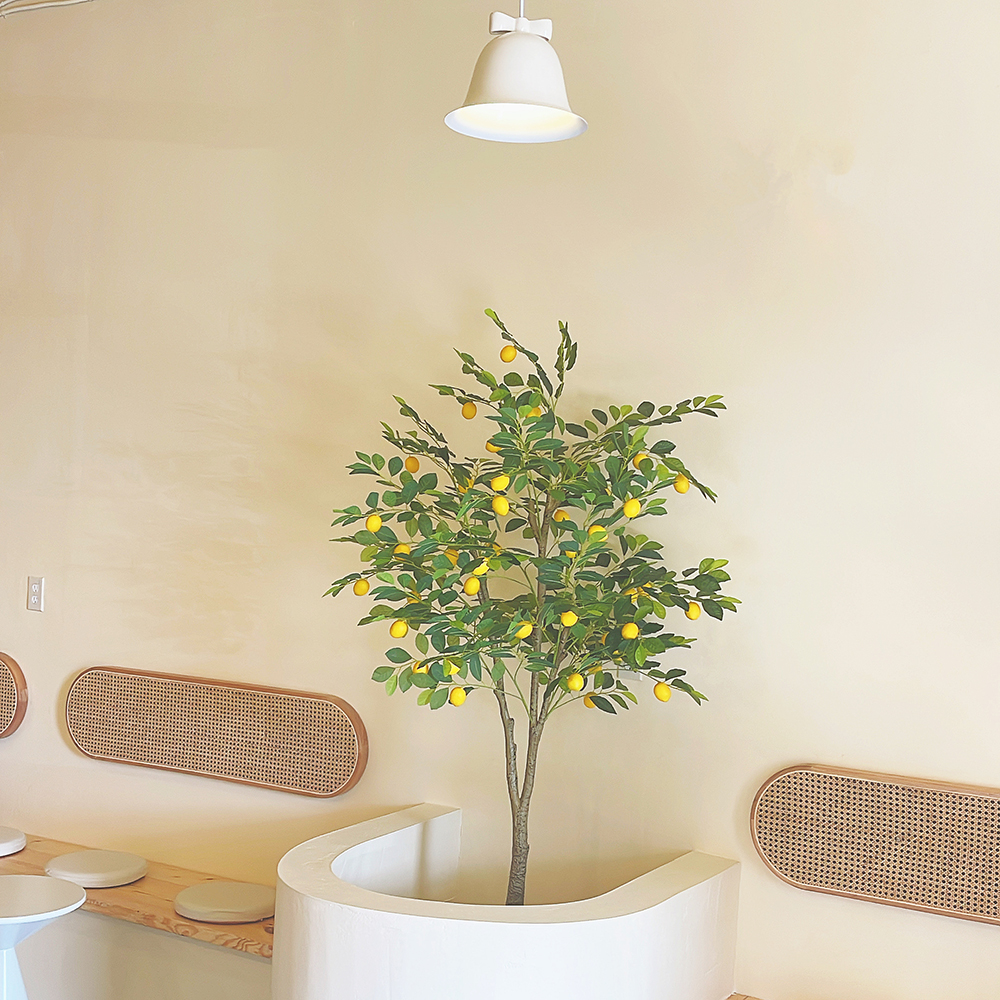 Artificial lemon tree decor in warm beige cafe space at Tea.Lab, a Bubble Tea Store in FL