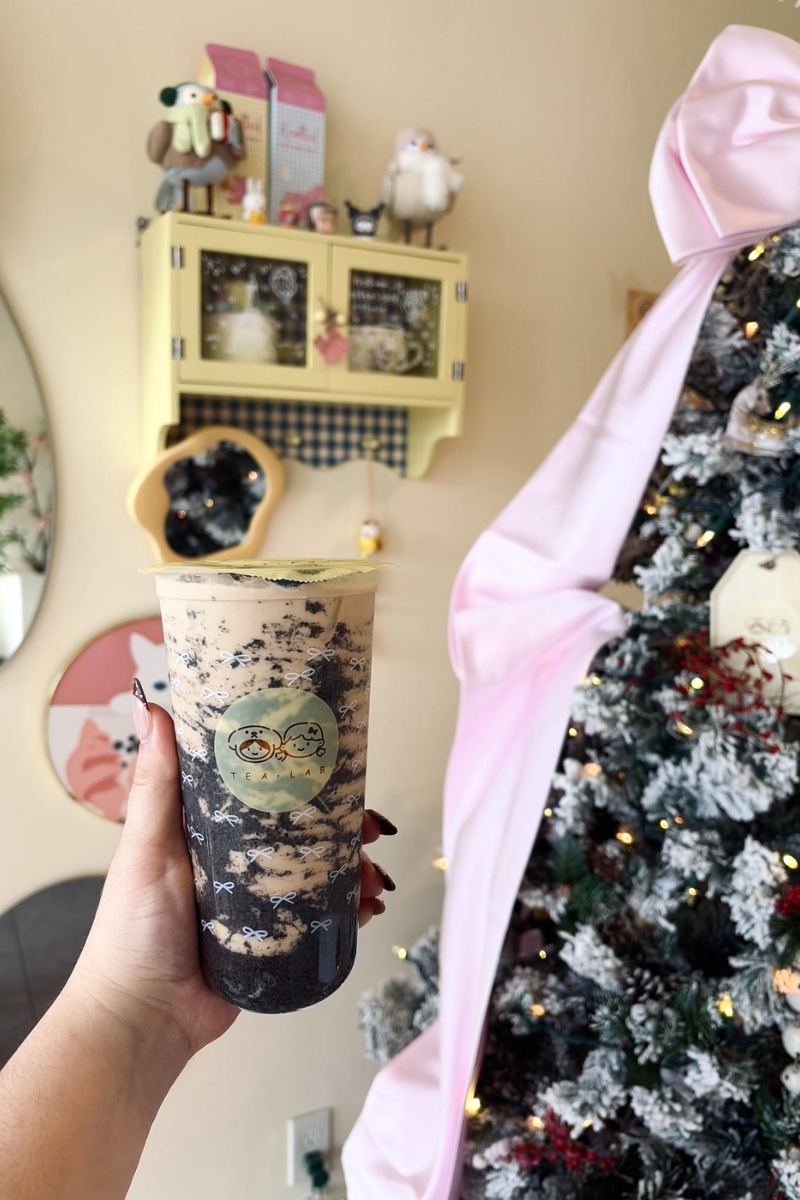 Black sesame layered milk tea by festive christmas tree at Tea.Lab, a Bubble Tea Store in FL