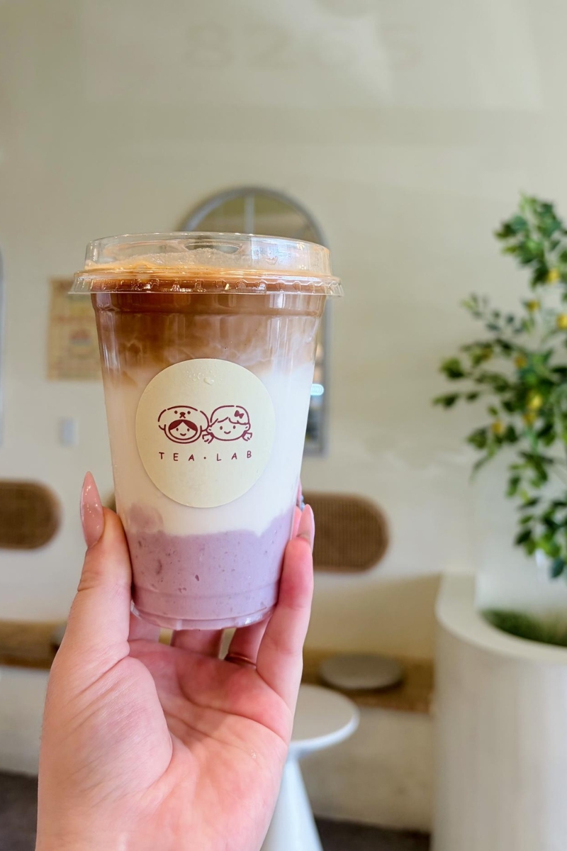 Taro layered latte bubble tea in hand at Tea.Lab, a Bubble Tea Store in FL