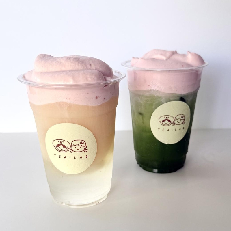 Two gradient bubble teas topped with pink cream foam at Tea.Lab, a Bubble Tea Store in FL