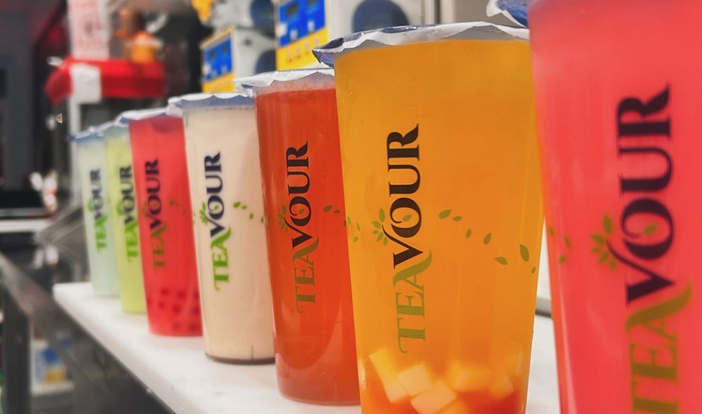 Row of vibrant Teavour fruit teas on shop counter