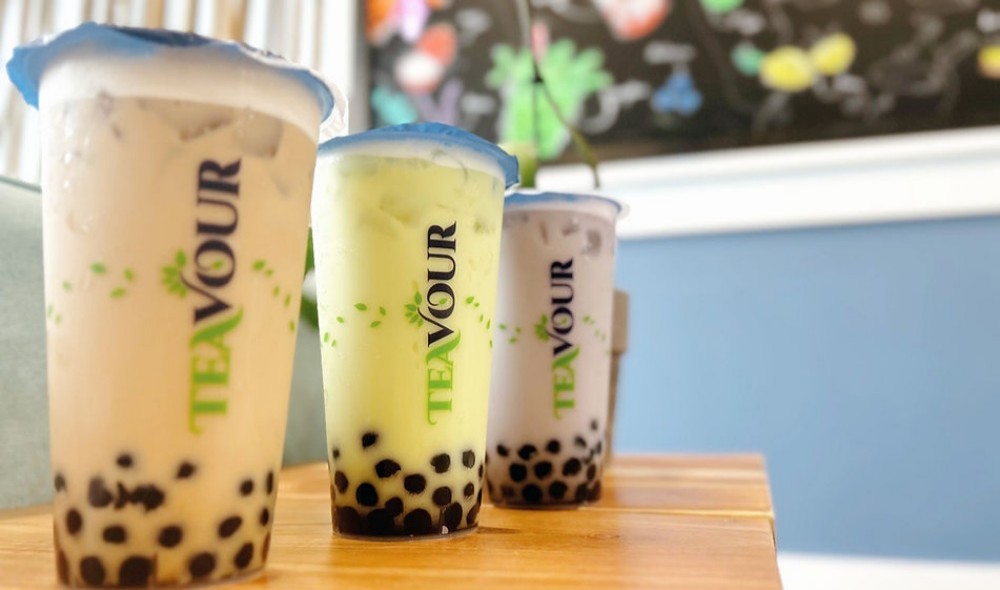 Three cups of Teavour bubble tea on wooden table