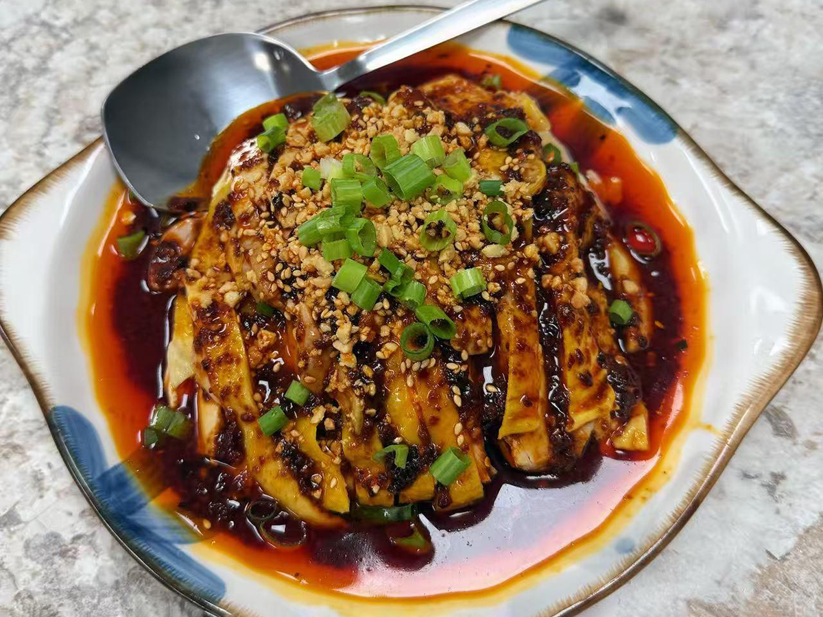 Spicy tender sliced chicken in rich red chili oil sauce at Teng Jiao Wu 藤椒屋，a Chinese Restaurant in Flushing