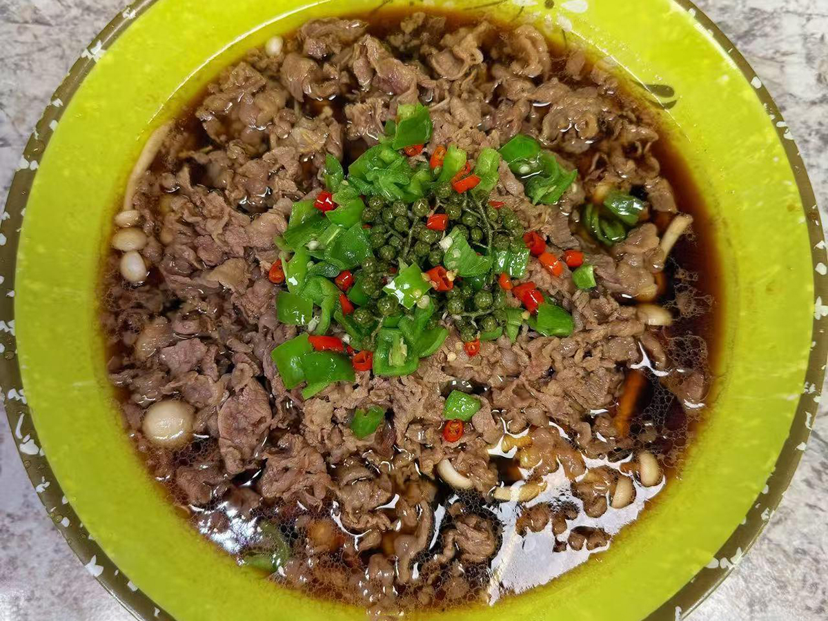 Peppery boiled beef slices with fresh Sichuan peppercorns and peppers at Teng Jiao Wu 藤椒屋，a Chinese Restaurant in Flushing