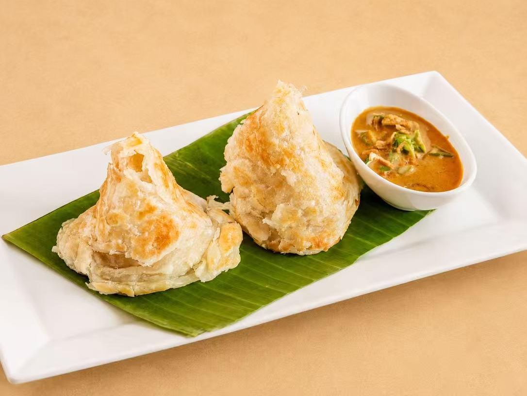 Crispy roti with masaman curry dipping sauce at Thai Society, a Thai Restaurant in Westfield