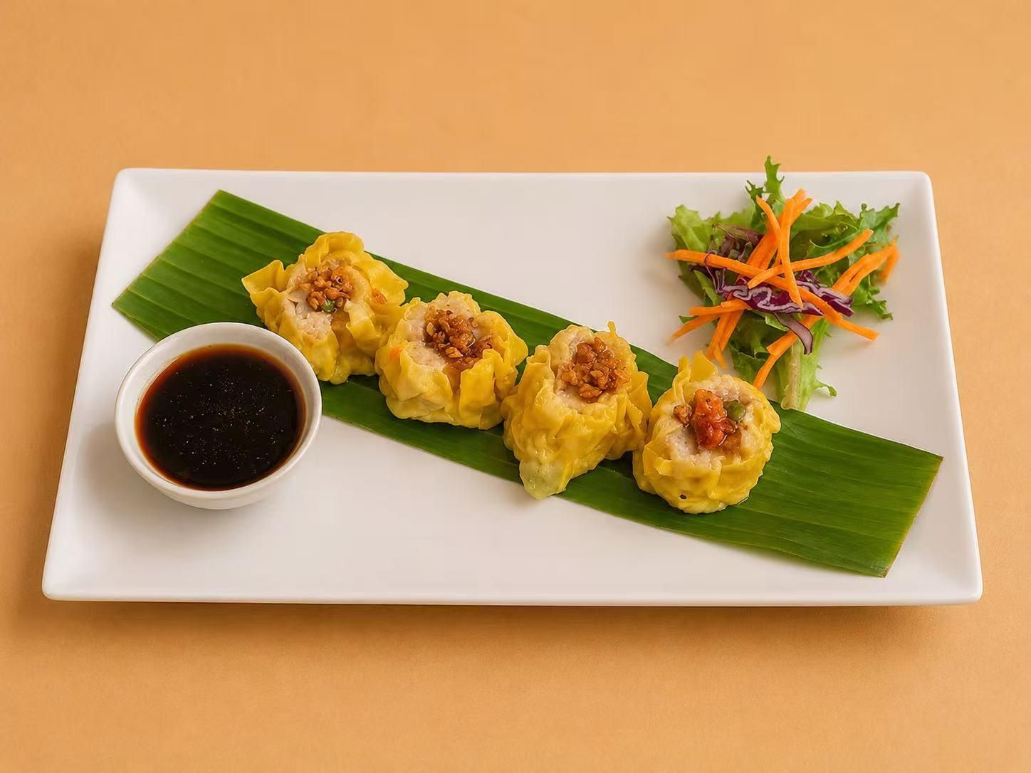Steamed pork dumplings with soy dipping sauce at Thai Society, a Thai Restaurant in Westfield