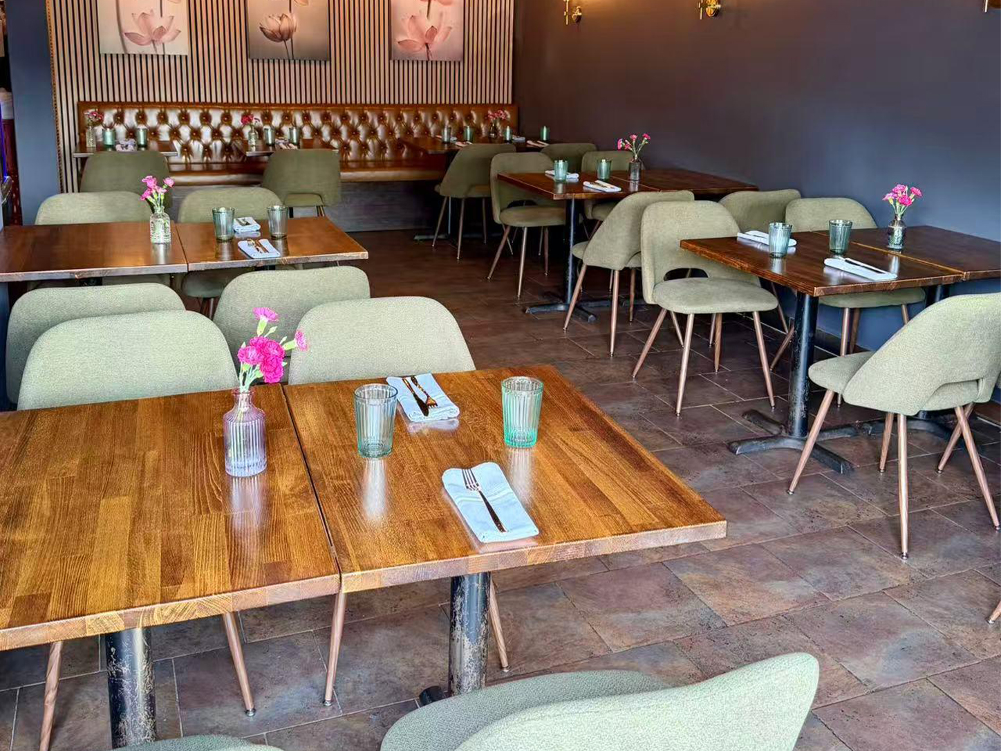 Modern Thai Society Dining Room with Wooden Tables and Floral Decor