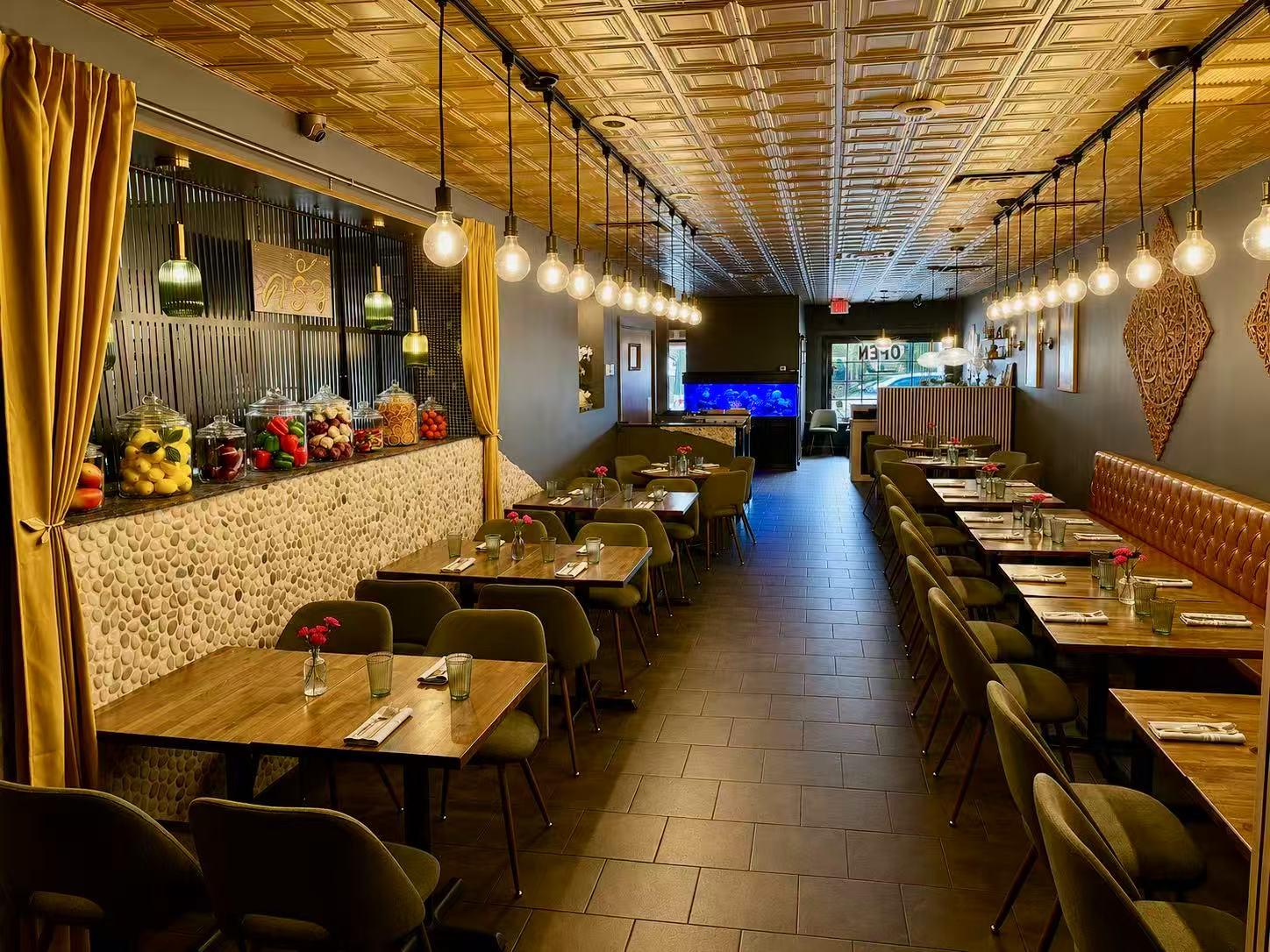 Spacious Thai Restaurant Dining Area with Golden Ceiling and Table Settings