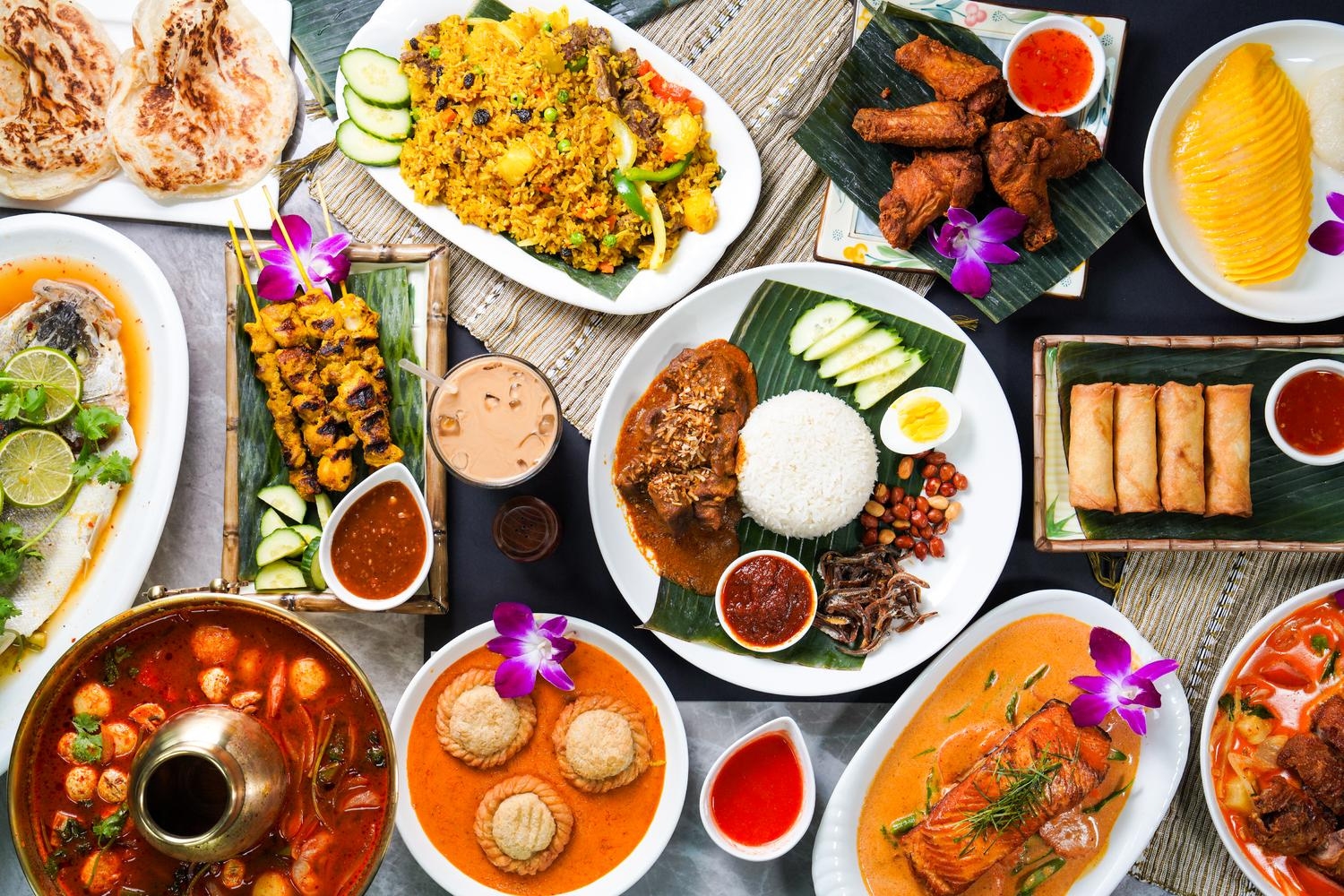 Assorted Thai feast with curry, satay, tom yum and mango sticky rice