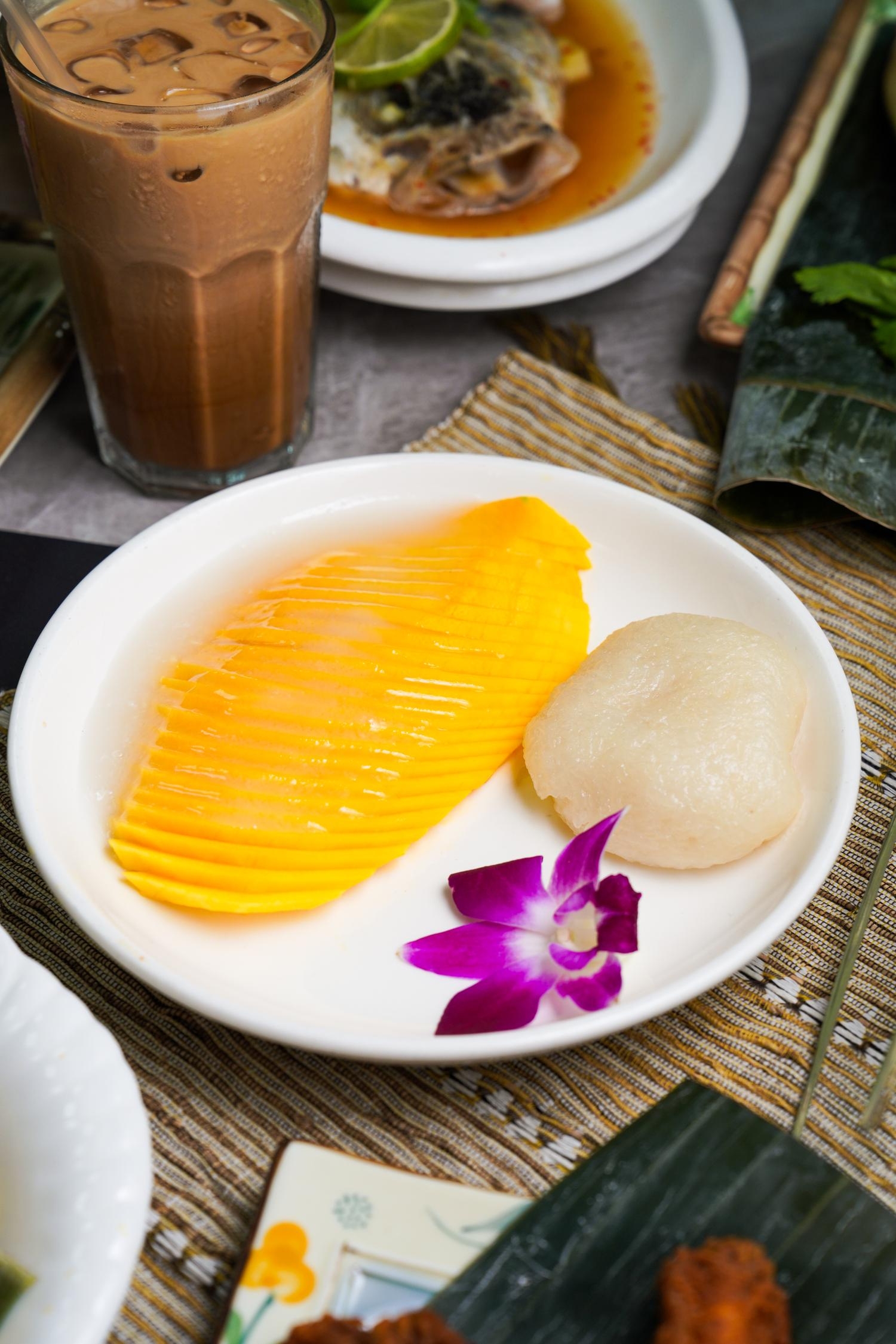 Mango sticky rice served with fresh sliced mango and sweet glutinous rice