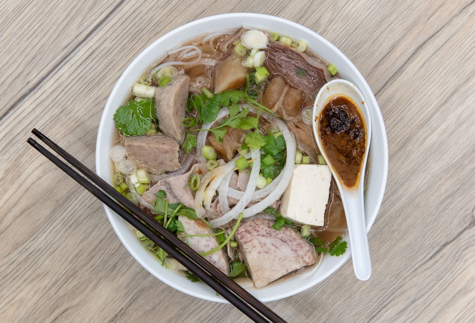 Beef pho noodle soup with herbs and tofu at Thanh Binh, a Vietnamese Restaurant in Lake Forest