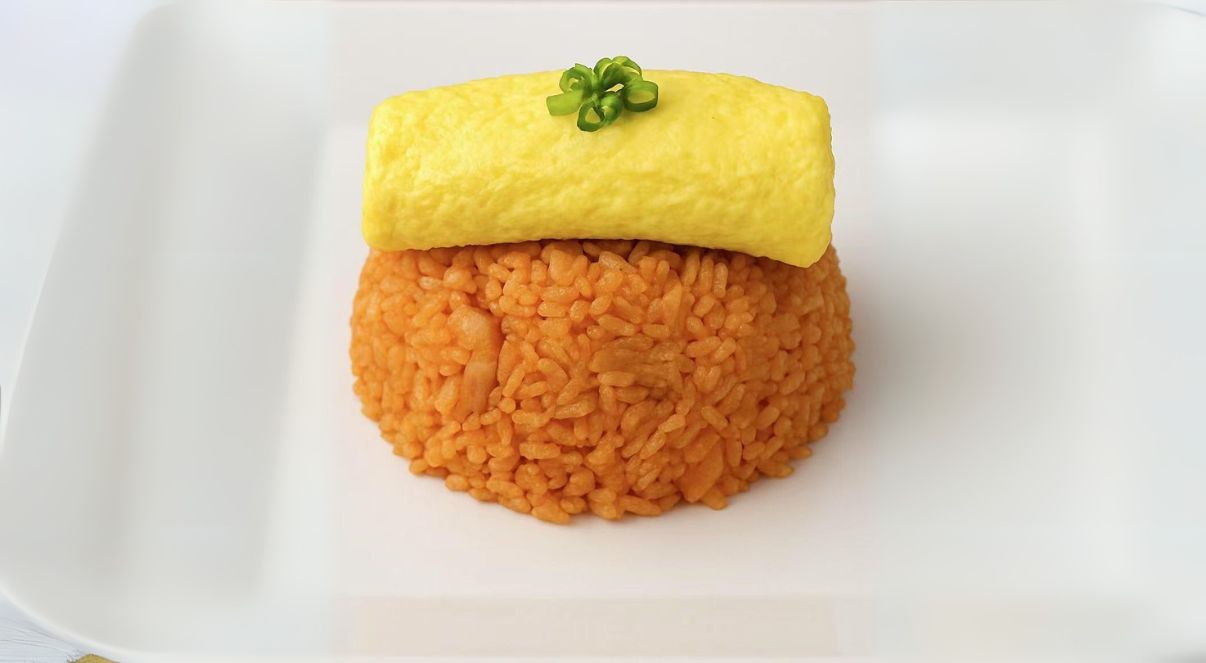 OmuRice - Tomato - flavored rice with omelette roll at The Don, a Asian Fusion Restaurant in Houston