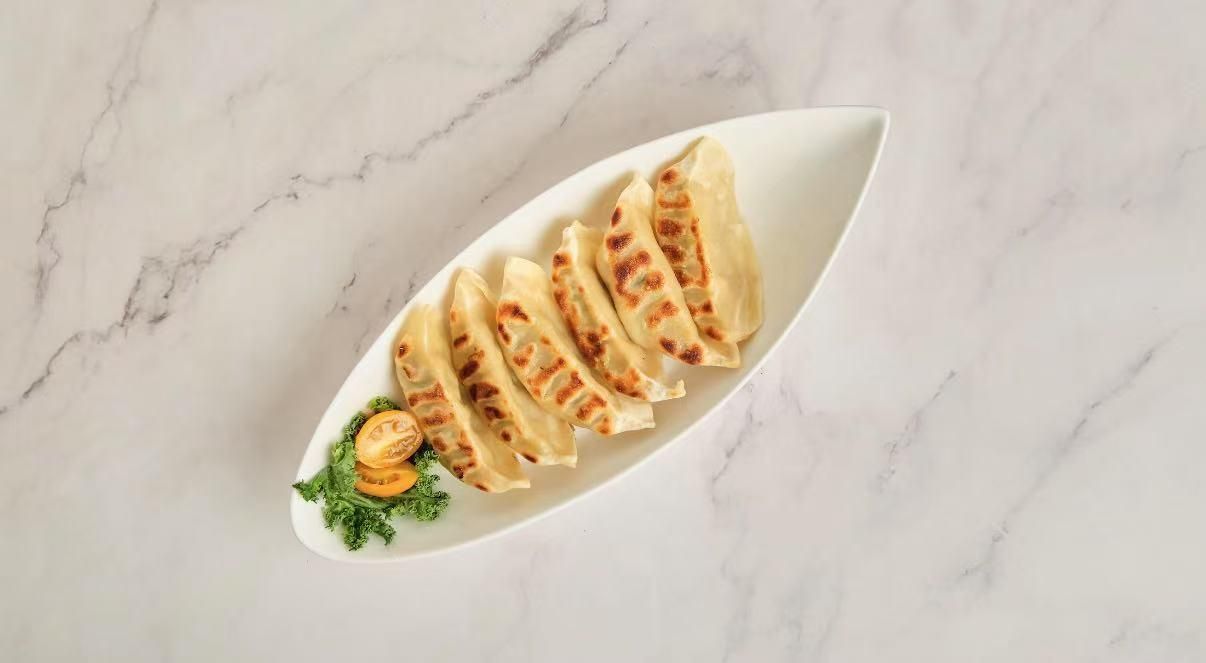 Pan Fried Gyoza - Crispy pan - fried dumplings with veggies at The Don, a Asian Fusion Restaurant in Houston