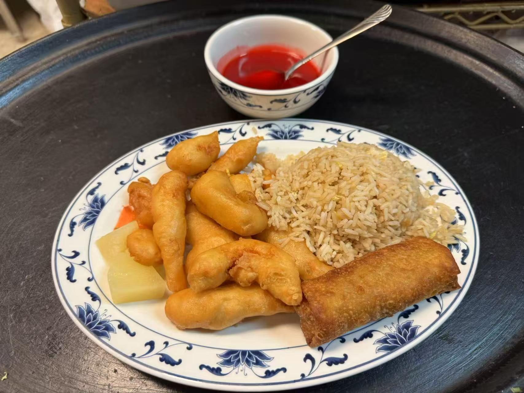 Fried rice, crispy egg roll, fried items at The Great Wall, a Chinese restaurant in Seguin
