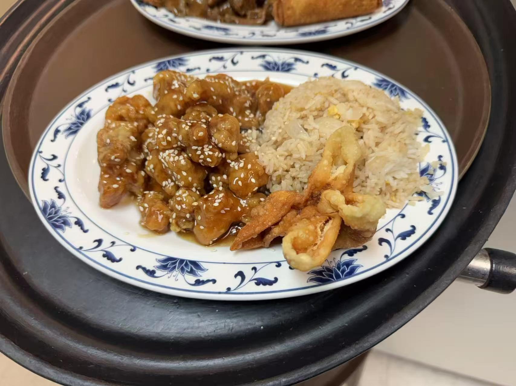 Fried rice, sesame - chicken in sauce, and crispy fried items
