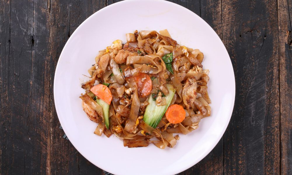 Chicken stir-fried wide rice noodles with vegetables and egg at The Imperial Treasure, a Chinese restaurant in Matthews