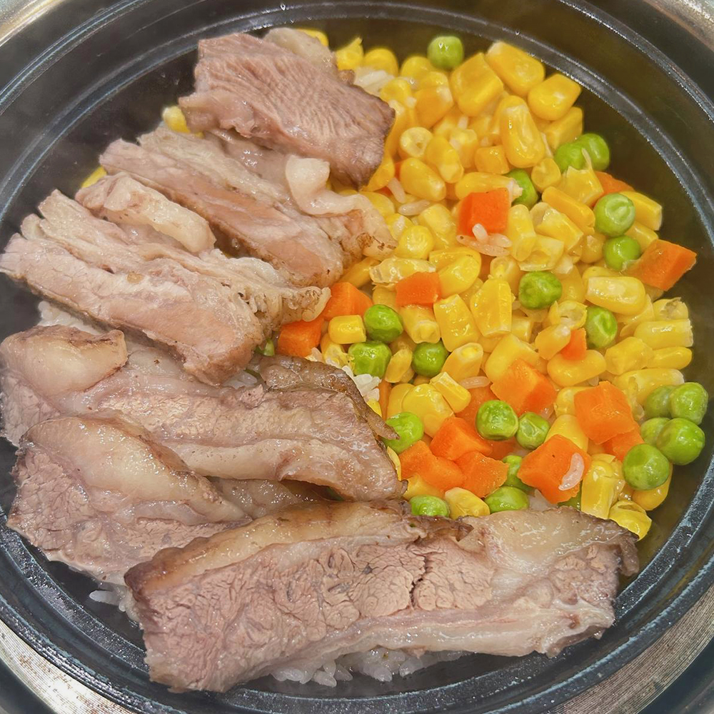 Hearty beef clay pot rice with mixed veggies at The Pancake, a Chinese Restaurant in Flushing