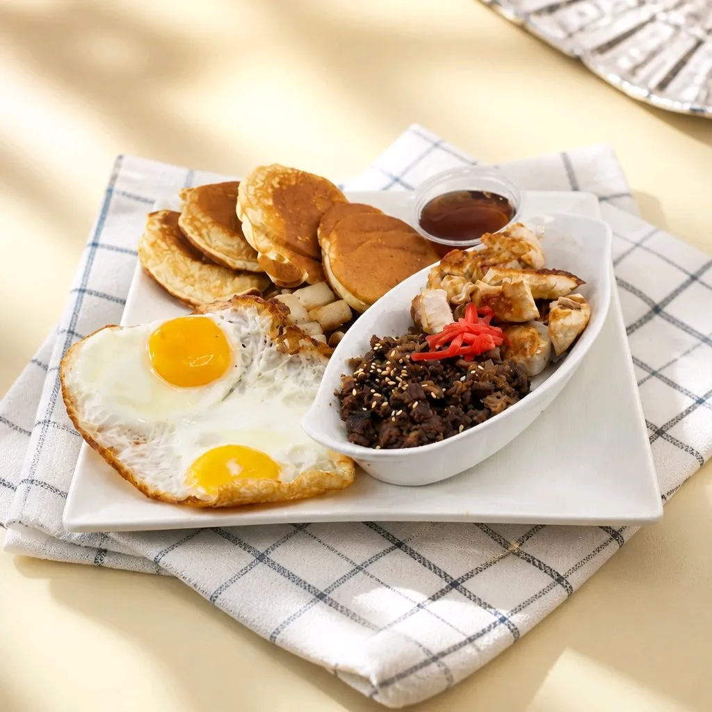 Breakfast platter with eggs, pancakes, chicken and minced beef at The Second Wind, a Breakfast Restaurant in El Segundo