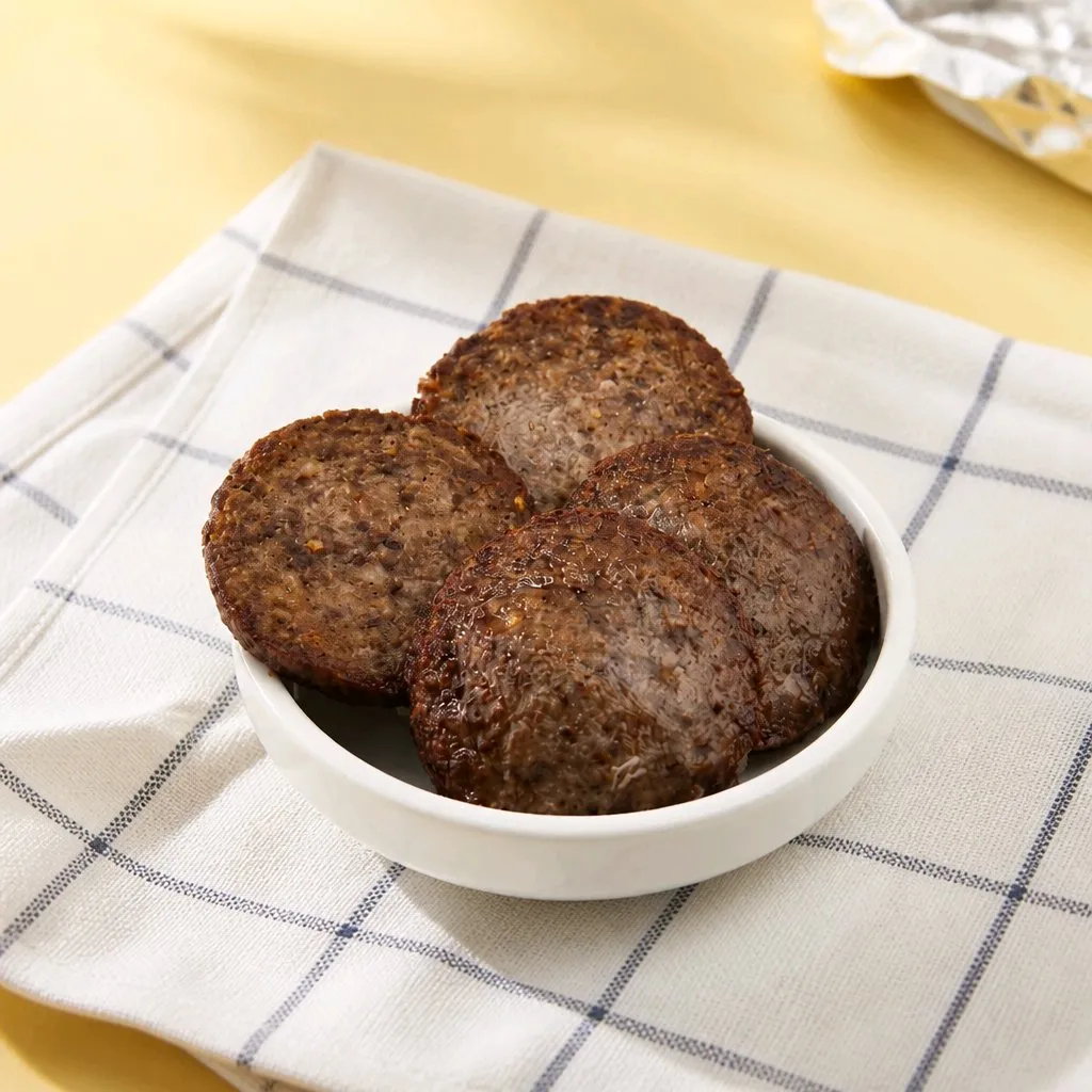 Four seasoned beef patties served in white bowl at The Second Wind, a Breakfast Restaurant in El Segundo
