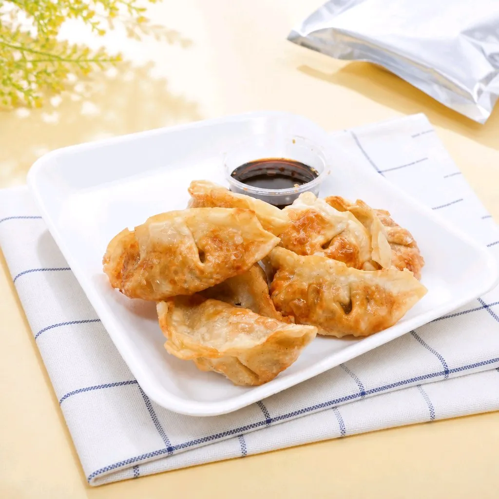 Pan-fried dumplings with soy dipping sauce on plate at The Second Wind, a Breakfast Restaurant in El Segundo