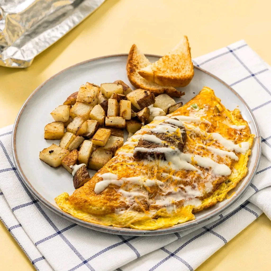 Steak cheese omelette with toast and roasted potato cubes at The Second Wind, a Breakfast Restaurant in El Segundo