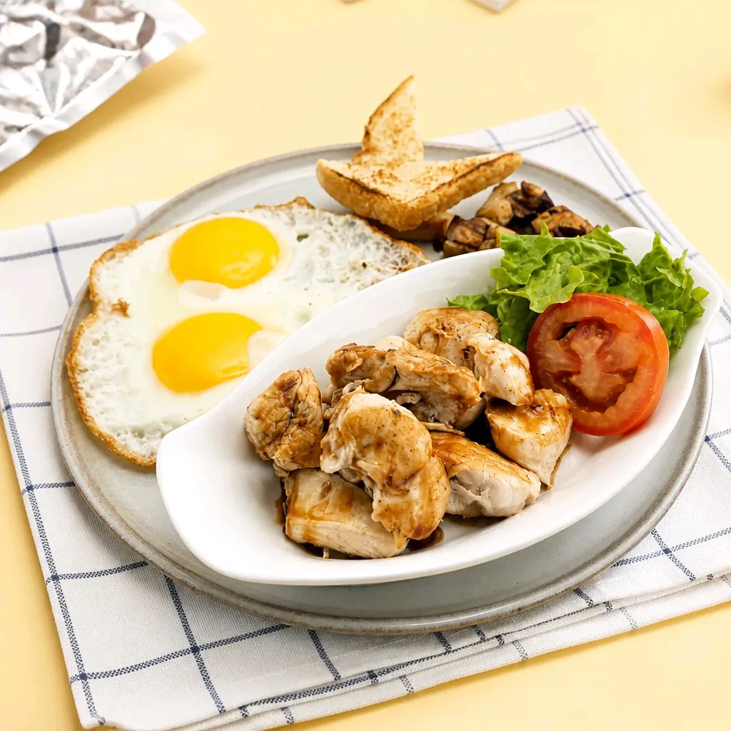 Two fried eggs, grilled chicken breast, toast & fresh veggies at The Second Wind, a Breakfast Restaurant in El Segundo
