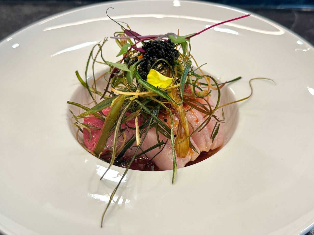 The-Shoya-Japanese-Restaurant-Fish-Course-With-Garnish-Pleasant-Hill Delicate fish dish topped with caviar and assorted greens at The Shoya, a Japanese Restaurant in Pleasant Hill