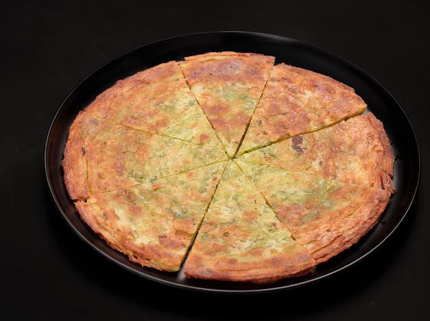Thumbling-Chinese-Dumpling-restaurant-Vegetable-Omelette-West-Covina Vegetable Omelette - A savory omelette filled with vegetables, cut into slices at Thumbling, a Chinese Dumpling restaurant in West Covina