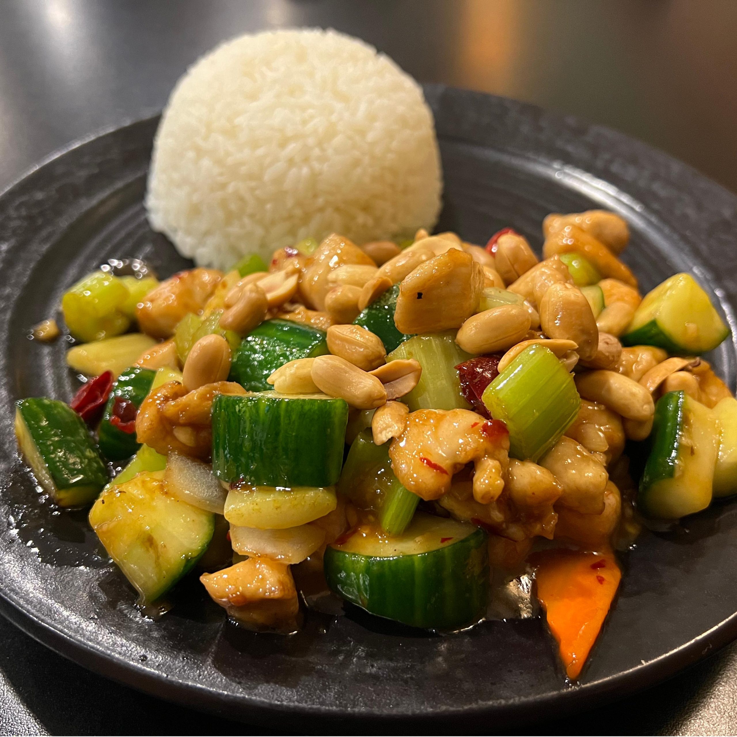 Kung Pao Chicken Rice Plate - Spicy chicken with peanuts, veggies, served with white rice at Tiger's Chinese Cuisine, a Chinese Restaurant in Houston