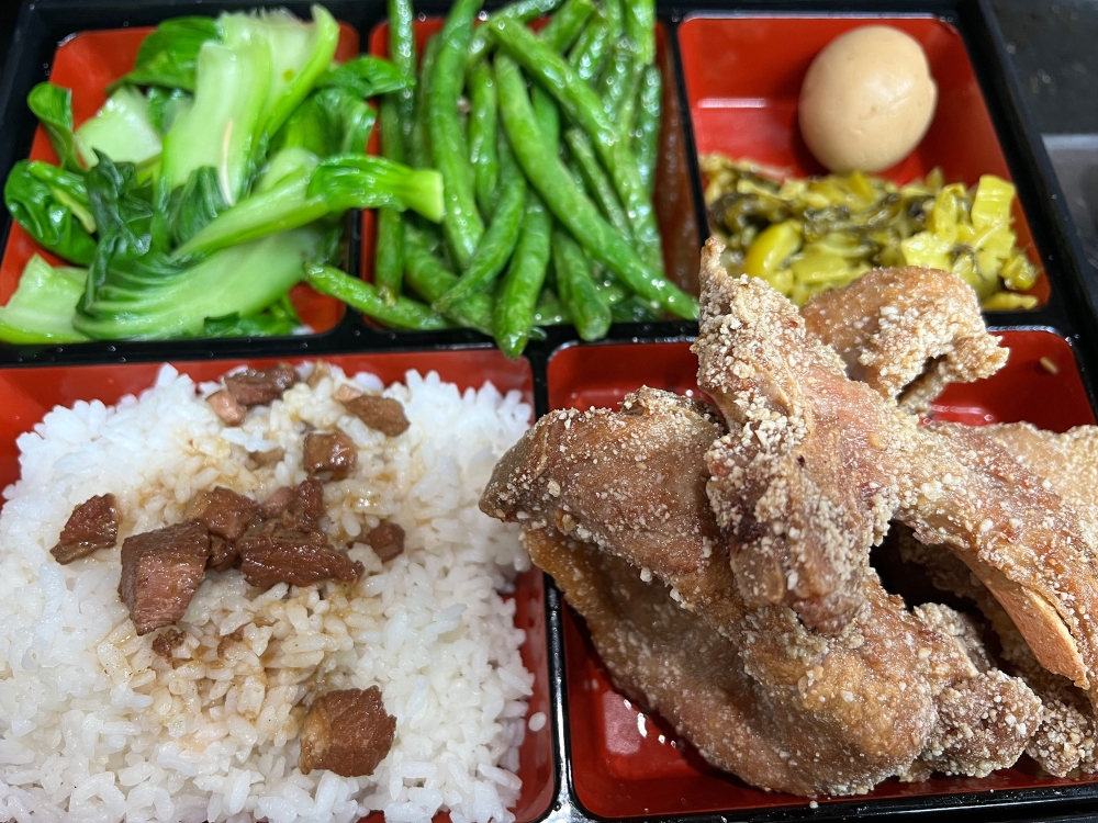 Taiwanese bento box with rice, fried pork, veggies, and egg at Ti Hu Taiwanese Noodle House, a Chinese Restaurant in Bayside
