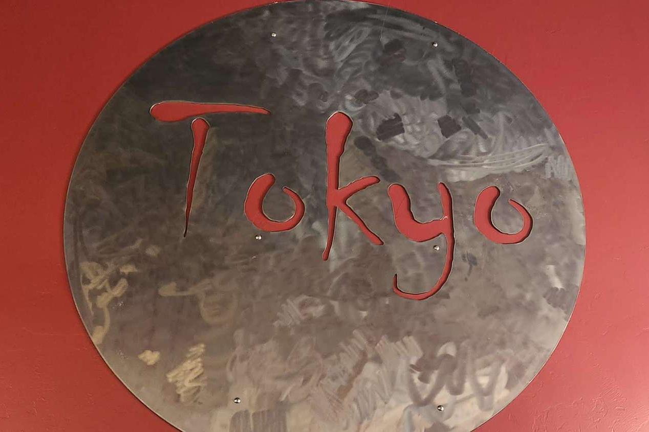 Exterior View - Building facade with “Tokyo” sign and “OPEN” neon at Tokyo Japanese Restaurant in Twin Falls