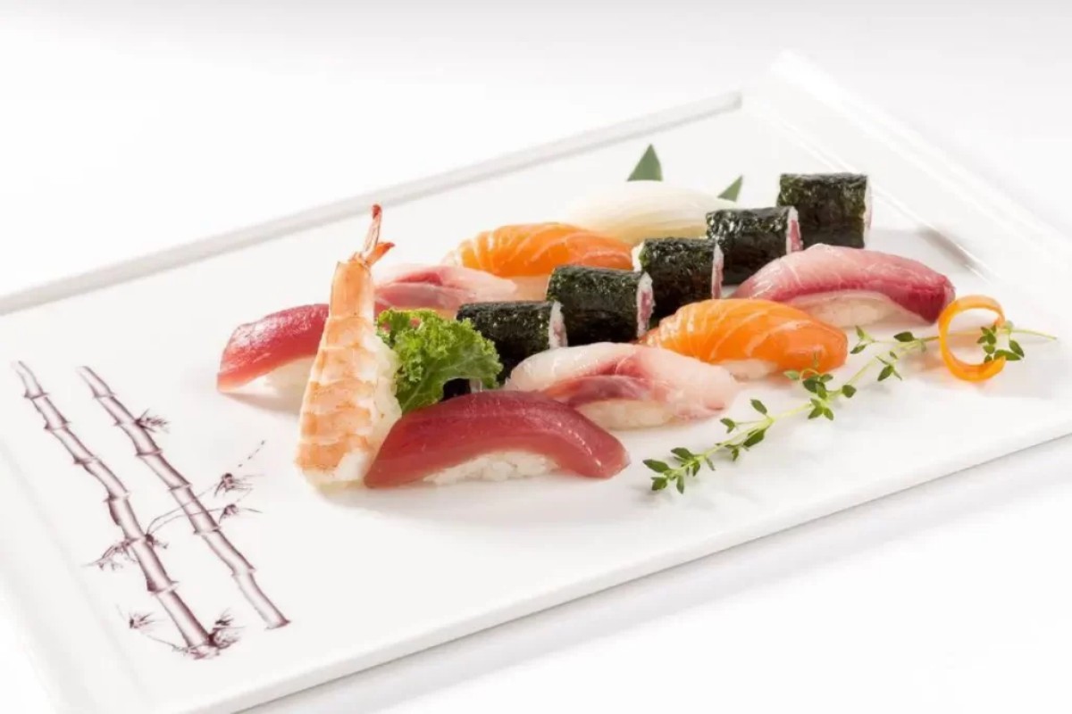 Assorted nigiri and maki sushi bamboo print platter at Tony's Sushi & Steakhouse, a Japanese Restaurant in East Moriches