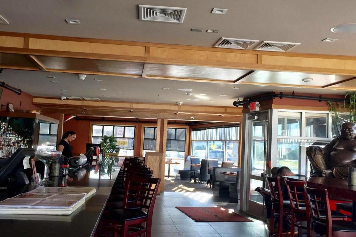 Bright bar and dining interior with wooden decor at Tony's Sushi & Steakhouse, a Japanese Restaurant in East Moriches