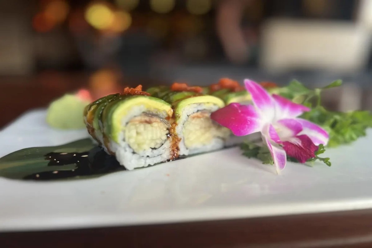Eel avocado sushi roll garnished with orchid flower at Tony's Sushi & Steakhouse, a Japanese Restaurant in East Moriches
