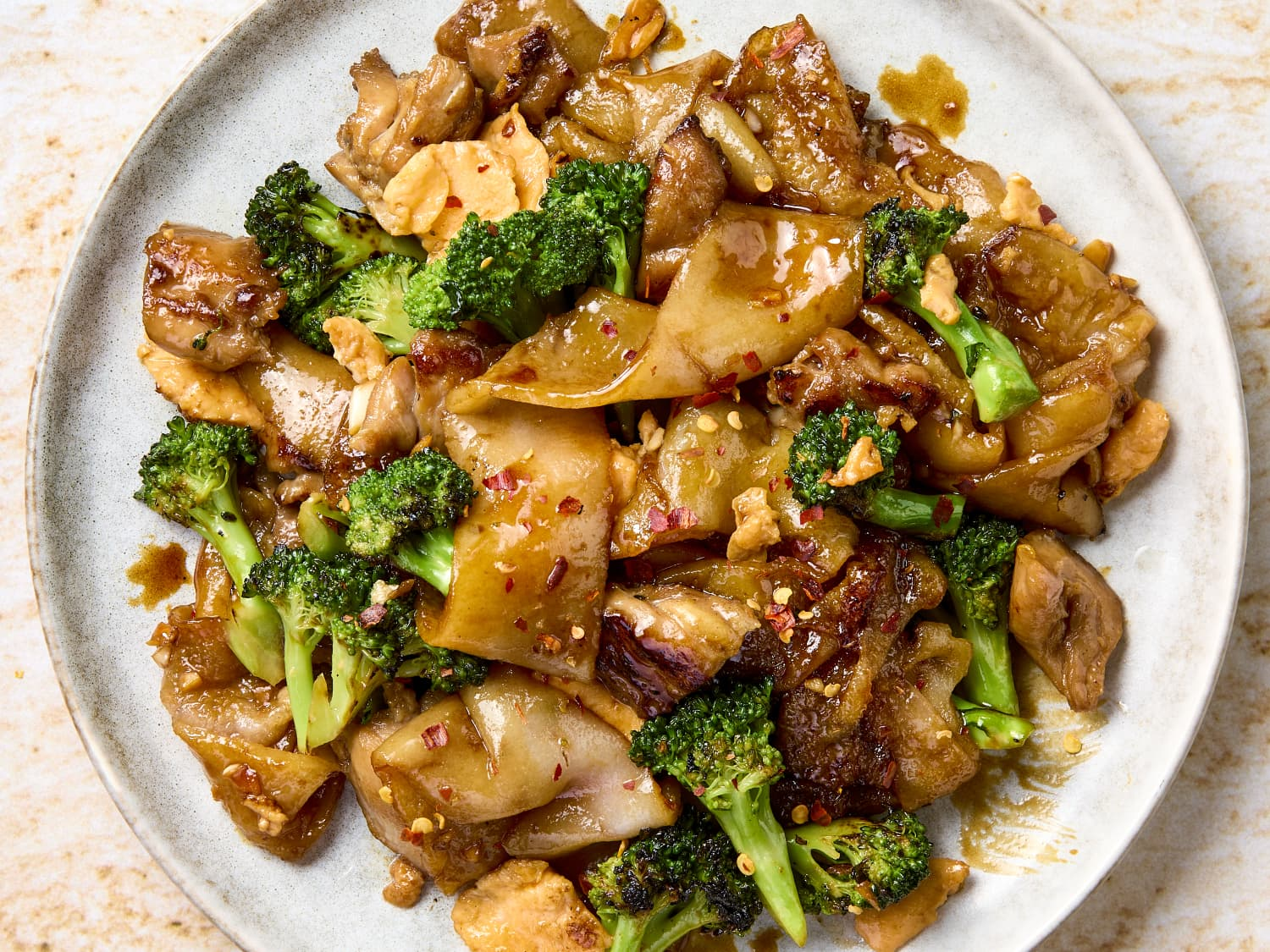 Chicken and broccoli stir - fried with wide noodles in a savory sauce at Tora Sushi, a Asian Fusion Restaurant in Media