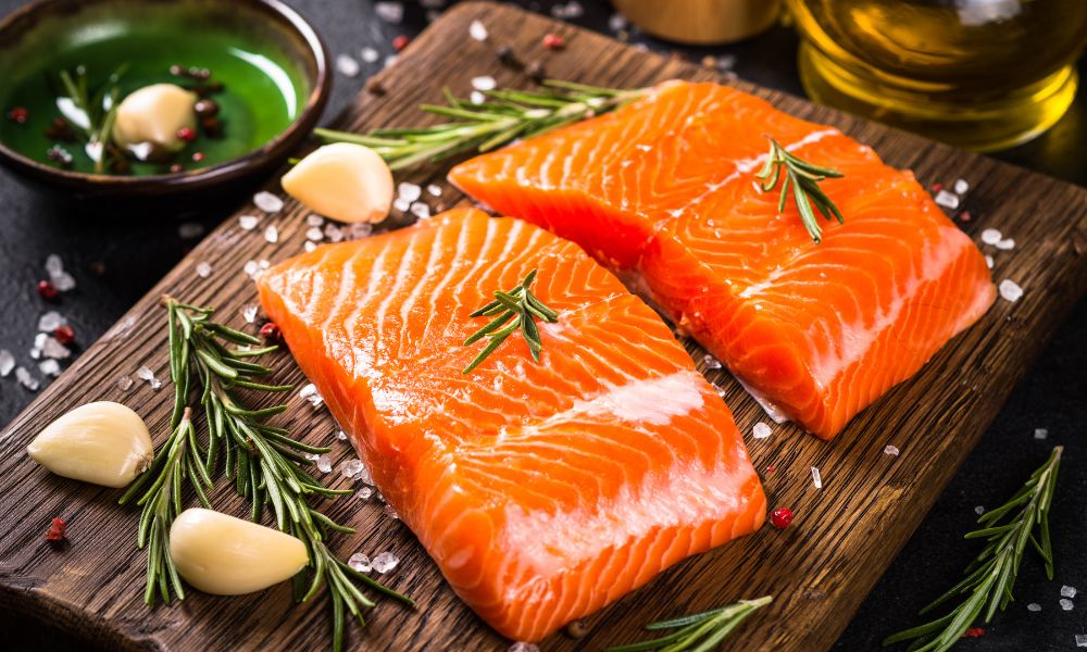 Fresh raw salmon fillets with rosemary, garlic, and salt at Toro 7 Sushi, a Sushi Restaurant in New York
