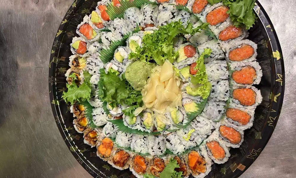 Large sushi roll platter with spicy tuna, salmon avocado, and eel rolls at Toro 7 Sushi, a Sushi Restaurant in New York