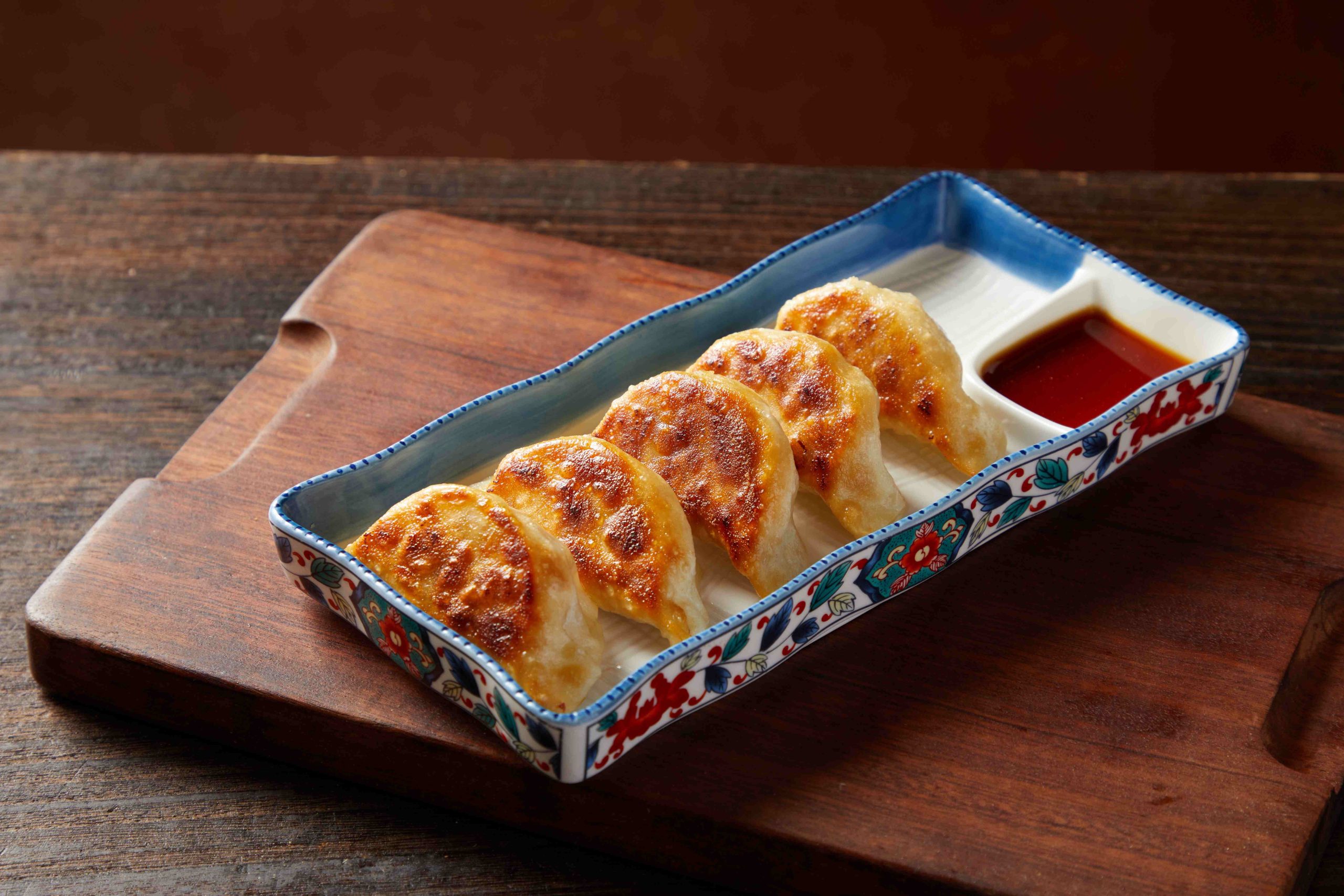 Tosakko-Ramen-&-Yakitori-Japanese-restaurant-Homemade-Pan-Fried-Gyoza-Pasadena Crispy pan - fried gyoza served with dipping sauc at Tosakko Ramen & Yakitori, a Japanese restaurant in Pasadena