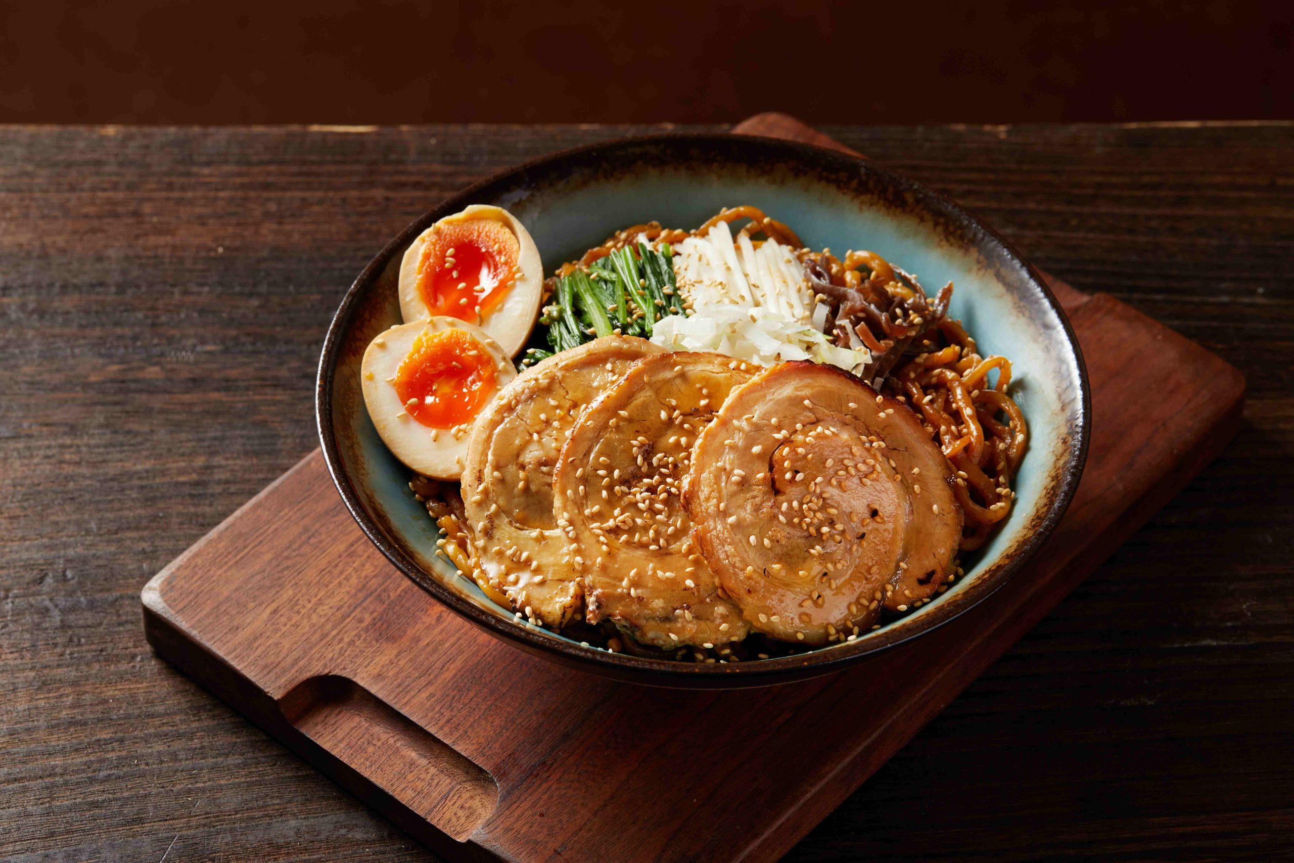 Tosakko-Ramen-&-Yakitori-Japanese-restaurant-Signature-Rich-Back-Fat-Mazesoba-Pasadena Mazesoba with sesame - topped charsiu, eggs, and fresh ingredients at Tosakko Ramen & Yakitori, a Japanese restaurant in Pasadena