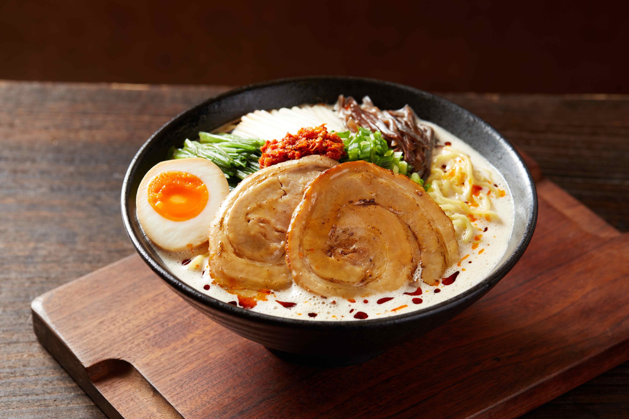 Tosakko-Ramen-&-Yakitori-Japanese-restaurant-Spicy-Handcrafted-Foam-Tonkotsu-Ramen-Pasadena Spicy ramen with creamy broth, charsiu, egg and veggies