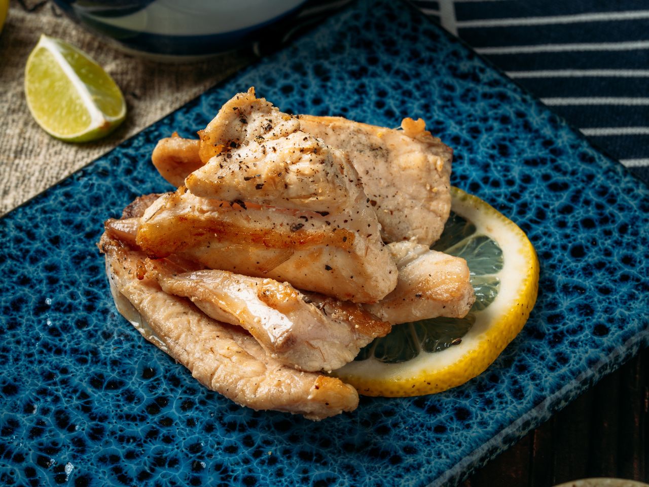Crispy grilled chicken cartilage served with lime at Tosakko Ramen & Yakitori, a Japanese Restaurant in Pasadena