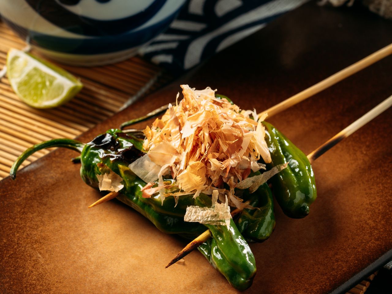 Grilled shishito pepper with bonito flakes at Tosakko Ramen & Yakitori, a Japanese Restaurant in Pasadena
